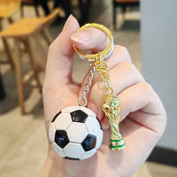 Black and white football + gold cup