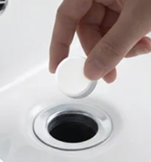 Drop drain tablet into drain